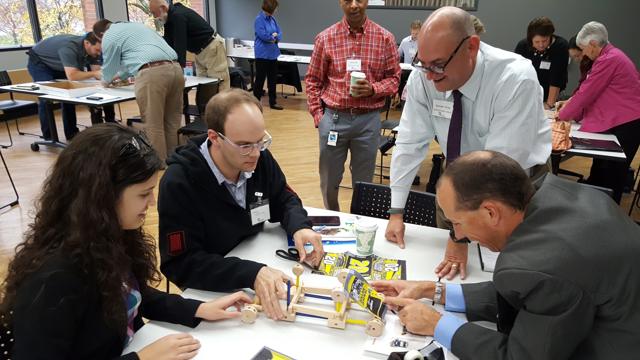Attendees working together at the hands-on Lean workshop